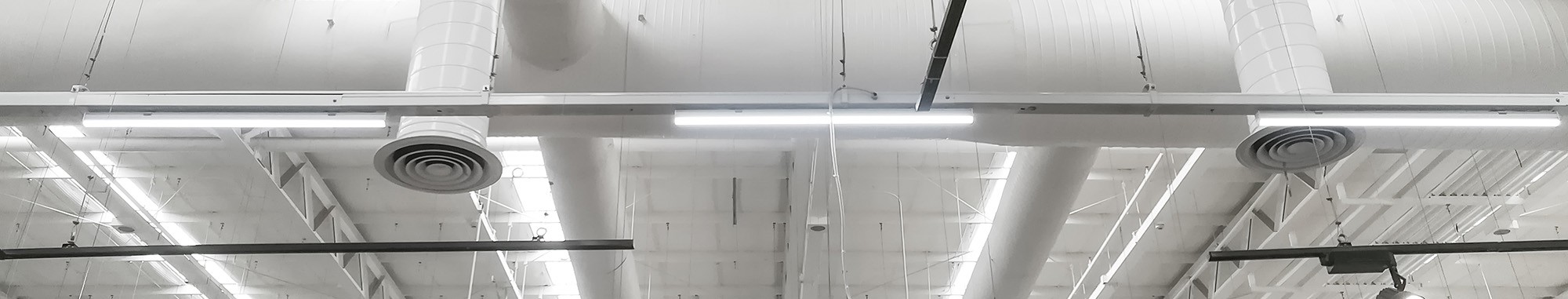 Duct work above Wisconsin businesses helped by Air Maintenance